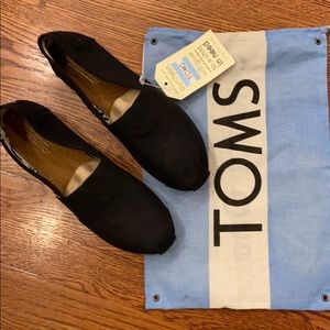 New with tags - TOMS black canvas shoes